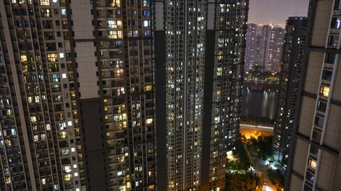 Day to night transition Timelapse of light in the windows of city building Stock Footage 107808168