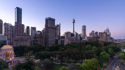Day to night view of Hyde Park and the skyline of Sydney Stock Footage 338288794