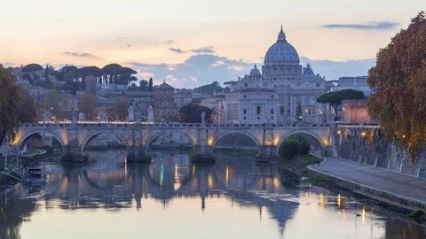 From day to night view of the St. Peter s basilica and  Angels bridge in Rome Video stock 83106555
