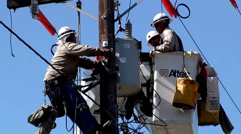 Day overhead crane electrician working maintaining power pole bucket truck video Stock Footage 40886949