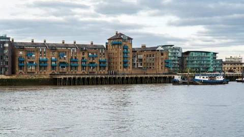 Day time apartment blocks of Tower Bridge Wharf, Thames Path, Wapping, London 스톡 동영상 103256434