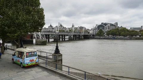 Day time Charing Cross station, Hungerford Bridge, river Thames, pedestrian Stock Footage 102333727