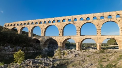 Day time lapse with sun of an old roman bridge, pont du gard aqueduct Stock Footage 95944752