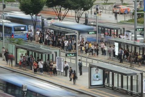 Day timelapse of buses making stops at Seoul Station in South Korea Stock Footage 111357340