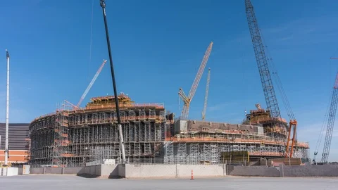 Day timelapse of MSG Sphere under construction with cranes, trucks, tradesmen Stock Footage 123441995