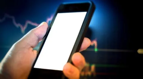 Day trader using phone Stock Photos