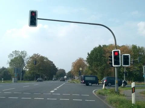 Day traffic intersection on stop red light Stock Photos