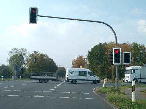 Day traffic intersection on stop red light Stock Photos