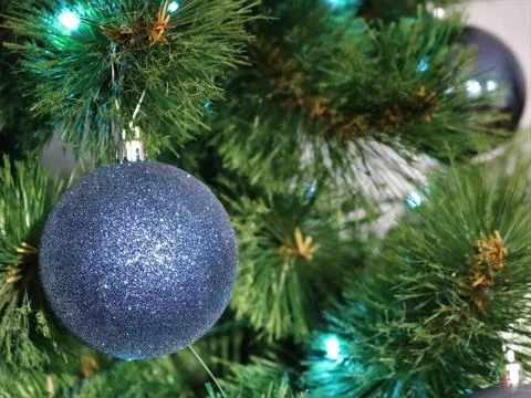 Day tree decorated with blue balls and lights Stock Photos