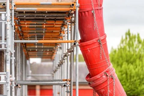Day view building under construction with scaffolding in England Photos
