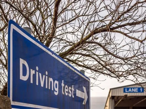 Day view driving test blue directional sign post in england uk Stock-Fotos