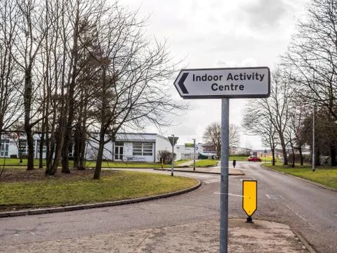 Day view Indoor Activity Centre directional road sign post on british road 스톡 사진