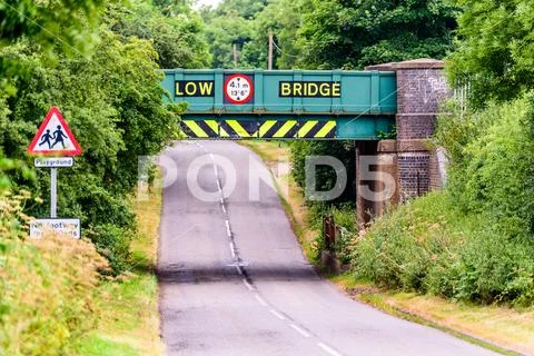 Day view of UK motorway highway under railway bridge Stock Photos