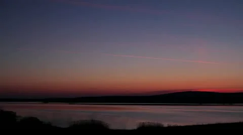 Daybreak over quiet lake Stock Footage 21992889