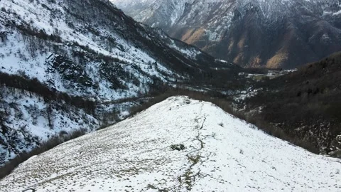 Daylight drone flight in mountain landscape with snow. Alps 4K. Aerial footage. Stock Footage 148031489