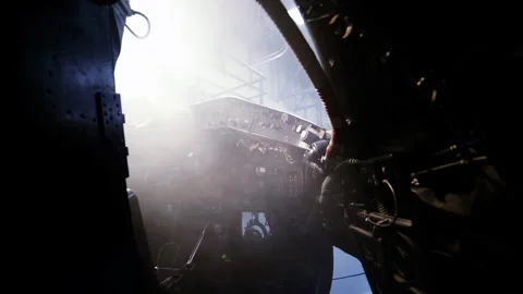 Daylight Filtering through Front Window of Cold War Combat Airplane - 4K Stock Footage 338348119