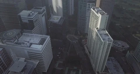 Daylight flight over High Rise Building's Helipads in Bgc, Manila Stock-Footage 128839013