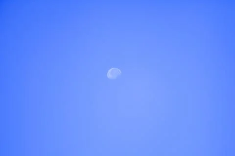 Daylight moon cloudless blue sky Foto stock