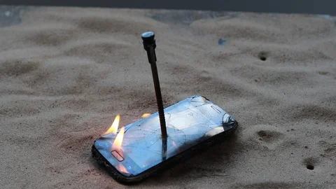 Daylight. The phone is damaged due to fire. in there is no damage. have toning Video stock 113398391