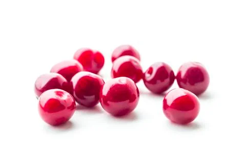 Daylight. red cherry on a white background. Berry rash and looks at us Stock Photos