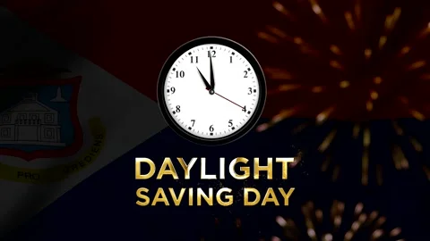 Daylight saving day concept featuring an analog clock over the national fla.. 스톡 동영상 346541317