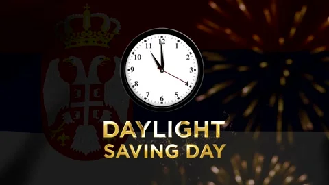 Daylight saving day concept featuring an analog clock over the national fla.. Видео 346541328