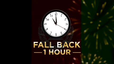 Daylight saving time concept with a clock showing fall back one hour agains.. Stock Footage 346542251