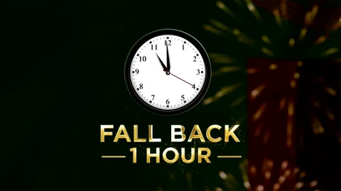 Daylight saving time concept with a clock showing fall back one hour reminder Видео 346542356