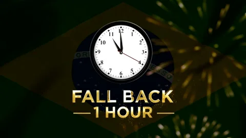 Daylight saving time concept with a clock showing falling back one hour aga.. Stock Footage 346542368