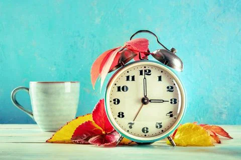 Daylight Saving Time concept, fall back in autumn. A vintage alarm clock Stock Photos