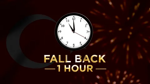 Daylight saving time concept showing a clock and fall back one hour text on.. Видео 346542063