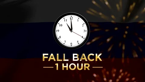 Daylight saving time concept showing a wall clock with text fall back one h.. Stock Footage 346542092
