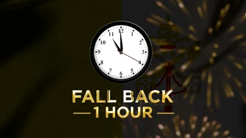 Daylight saving time concept showing a wall clock with text fall back one hou Stock-Footage 346542138