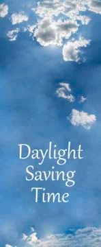 Daylight Saving Time (DST). Blue sky with white clouds and clock. Turn time f Stock Photos