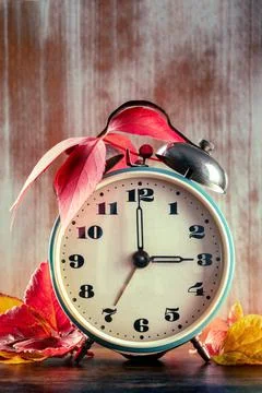 Daylight Saving Time, DST, concept, fall back in autumn. An alarm clock 스톡 사진