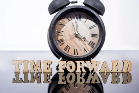 Daylight Saving Time. DST. Wall Clock going to winter time. Turn time forward Stock Photos