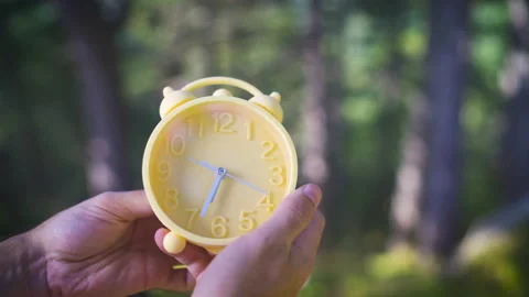 Daylight saving time end changing yellow clocks time Stock Footage 161150740