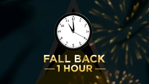 Daylight saving time fall back one hour concept with classic clock and glow.. Stock Footage 346542480