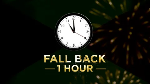 Daylight saving time fall back one hour concept with clock and golden text Stock Footage 346542493