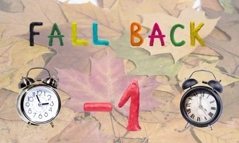 Daylight Saving Time. Wall Clock going to winter time. Autumn abstraction. Stock Photos