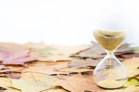 Daylight Saving Time. Wall Clock going to winter time. Autumn abstraction. Stock Photos