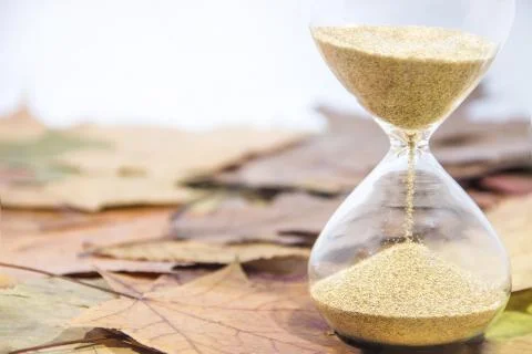 Daylight Saving Time. Wall Clock going to winter time. Autumn abstraction. Stock Photos