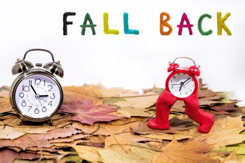 Daylight Saving Time. Wall Clock going to winter time. Autumn abstraction. Stock Photos