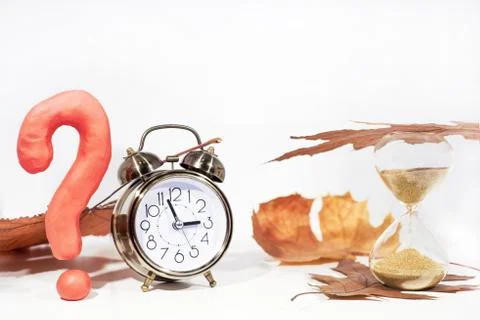 Daylight Saving Time. Wall Clock going to winter time. Autumn abstraction. Stock Photos