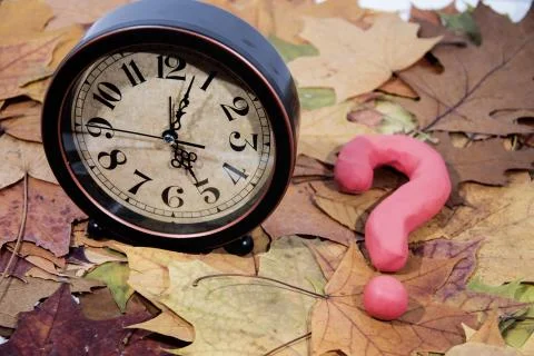 Daylight Saving Time. Wall Clock going to winter time. Stock Photos