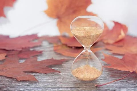 Daylight Saving Time. Wall Clock going to winter time. Stock Photos