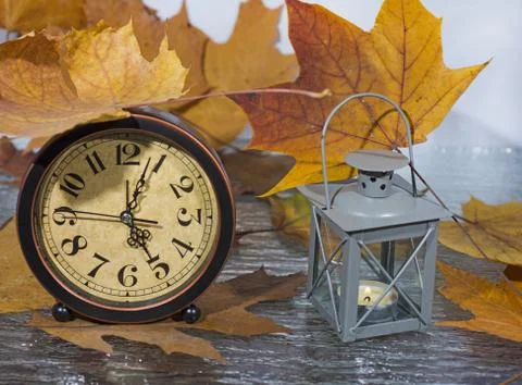 Daylight Saving Time. Wall Clock going to winter time. Stock Photos