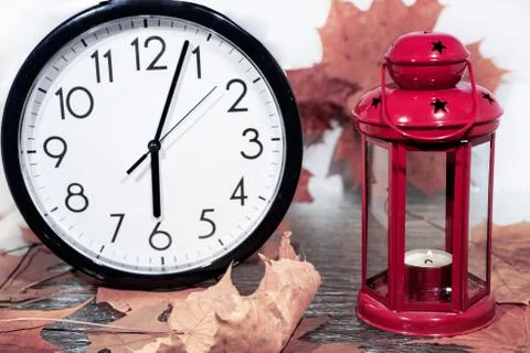 Daylight Saving Time. Wall Clock going to winter time. Stock Photos