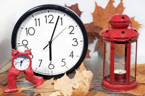 Daylight Saving Time. Wall Clock going to winter time. Stock Photos
