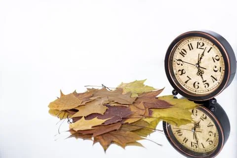 Daylight Saving Time. Wall Clock going to winter time. Stock Photos